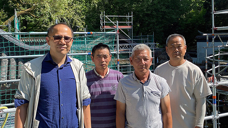 Hu Xiaojun und sein Team von Gartenbauexperten